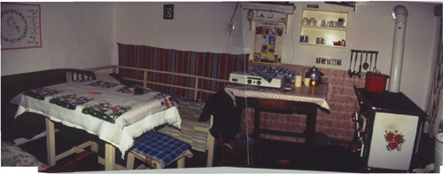 The kitchen/bedroom of the two-room Demeter home. The house looked typical of the village. The house had electricity, but no running water. (this is a composite of two photos) Courtesy D. Gonthier, taken 1989 Faj, Hungary